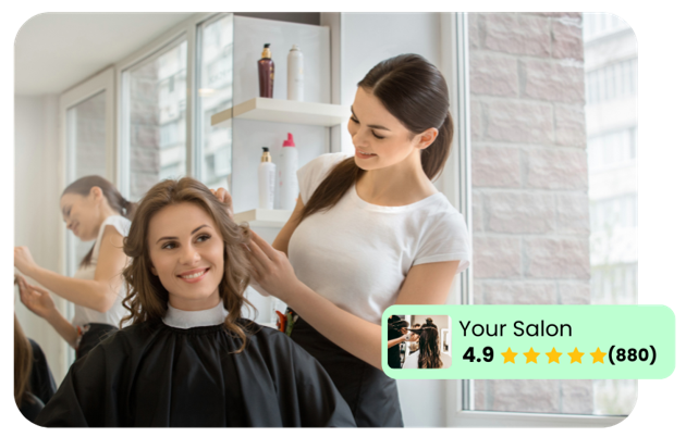 A woman is getting her hair cut at a salon.