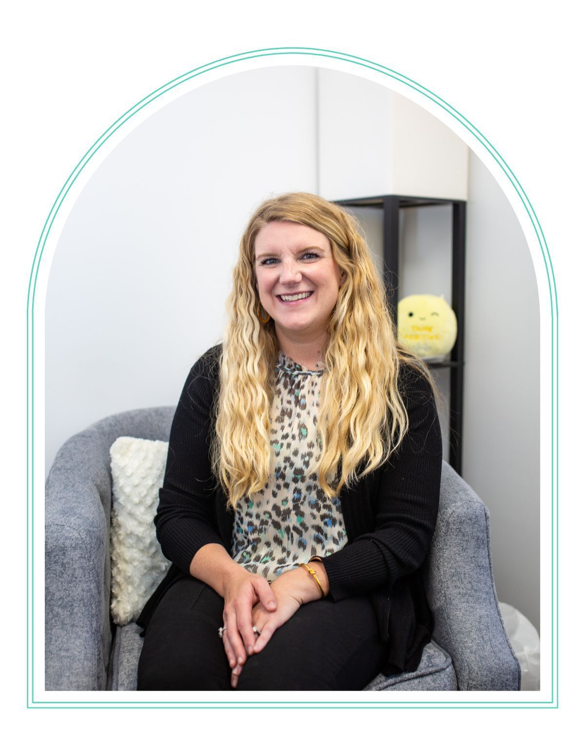 a woman holding a book titled good moms
