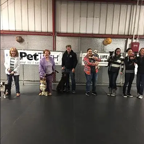 Barbara De Groodt working with a dog training class