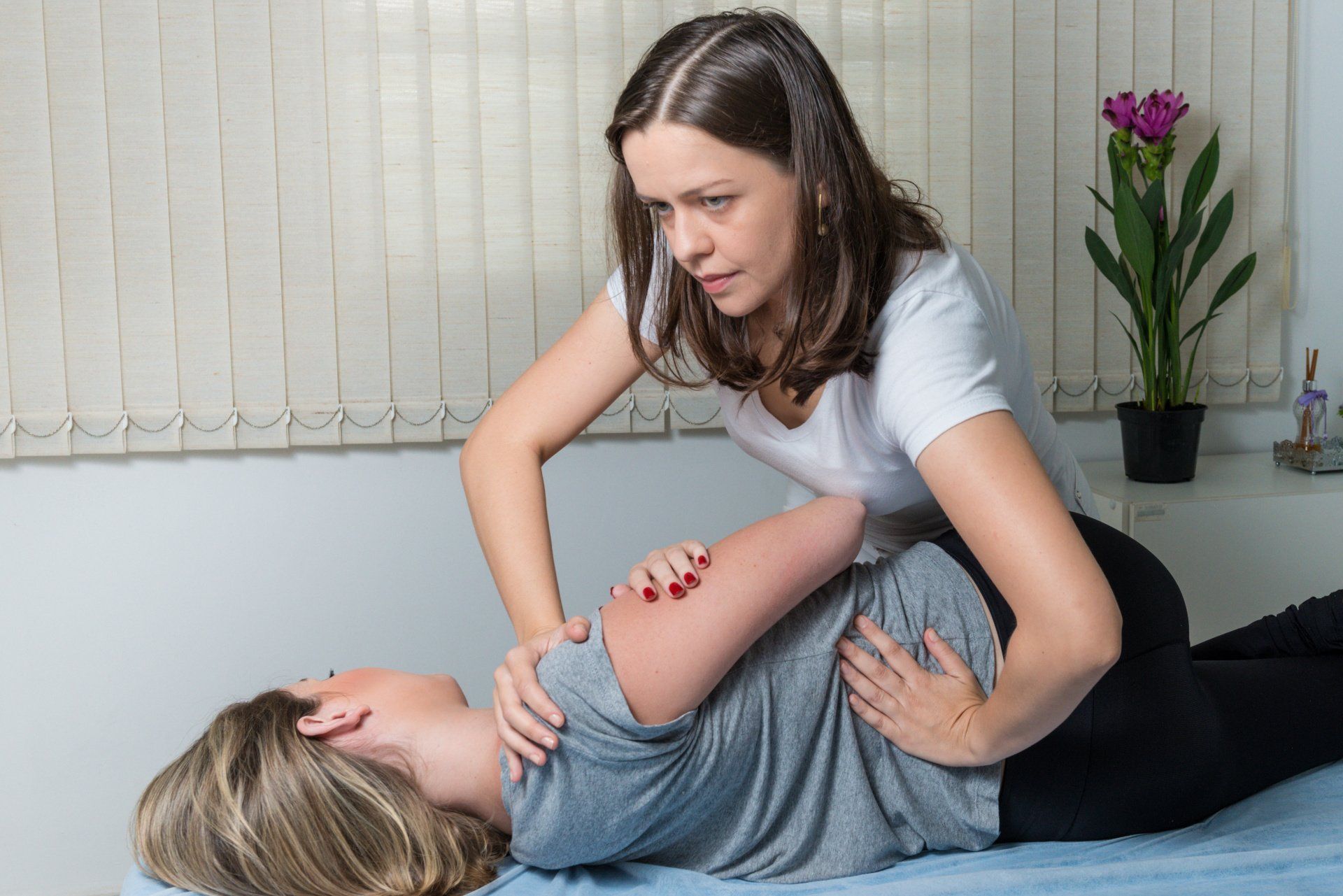 chiropractor giving care to a client