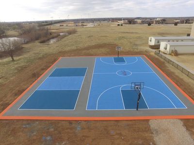 Basketball Court Construction — Blue Colored Basketball And Tennis Court in Oklahoma City, OK