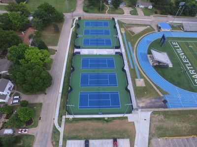 Tennis Court Construction — Aerial View Of Set Of Tennis Courts in Oklahoma City, OK
