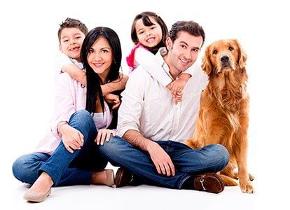 Smiling Family with Dog — Natraspray in Coffs Harbour, NSW