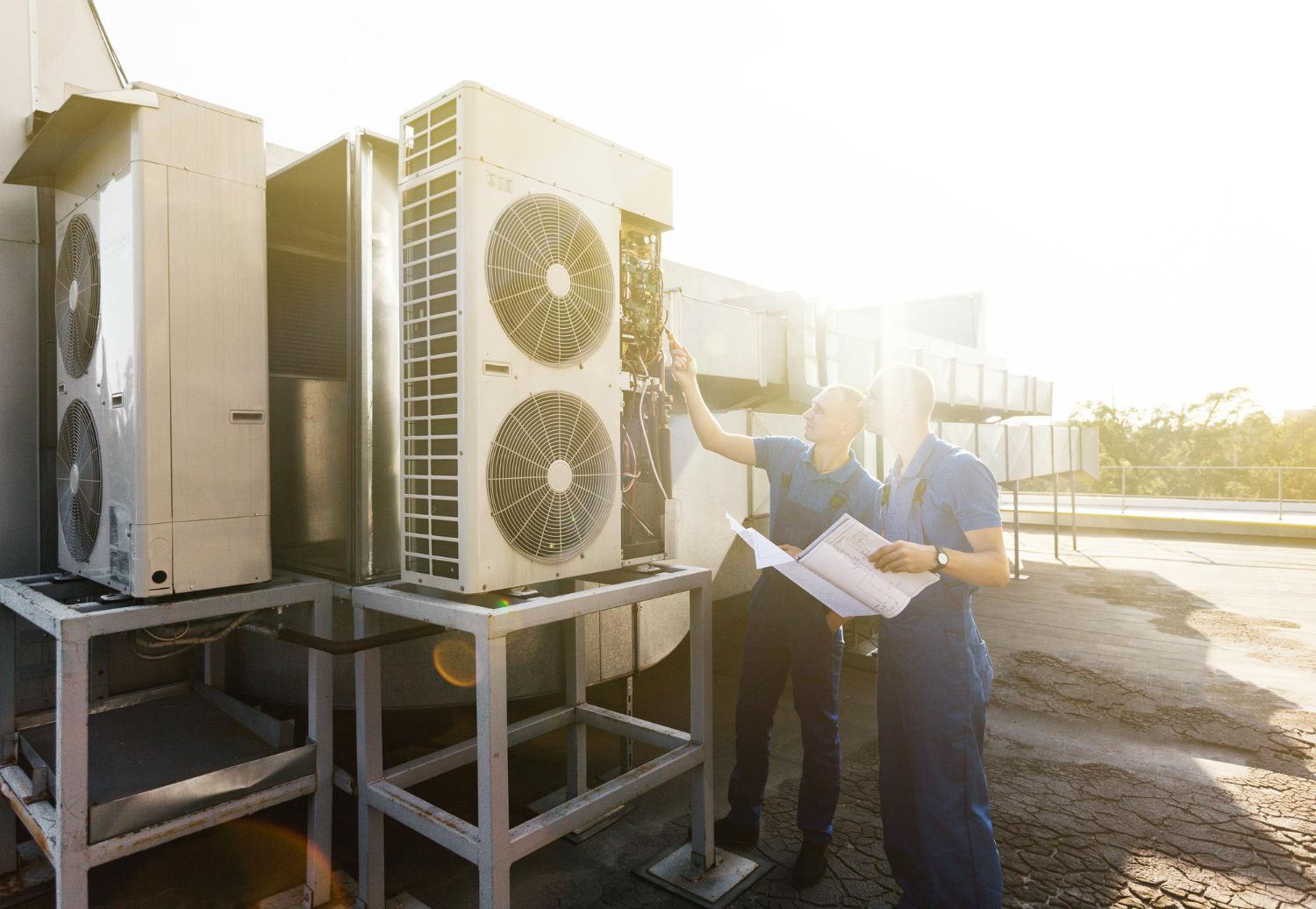 Bathroom with round mirror, water heater, and glass shower door.