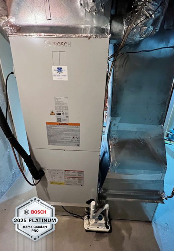 Woman warming hands by a wood-burning stove in a cozy, decorated room.