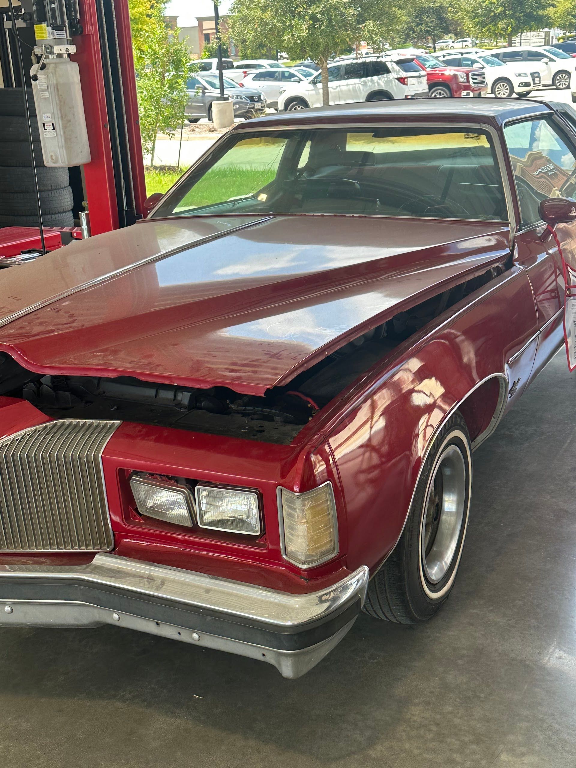 Classic Red Car Inside Repair Shop | Locals Automotive Repair