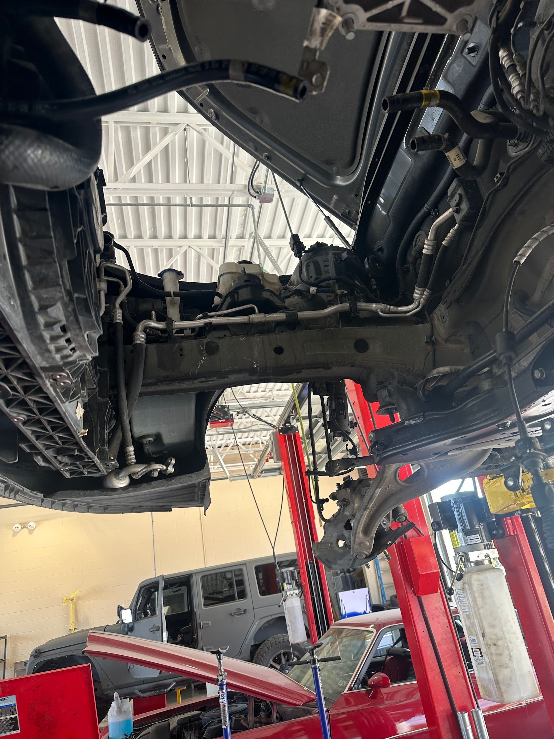 Vehicle Undercarriage On Auto Lift | Locals Automotive Repair