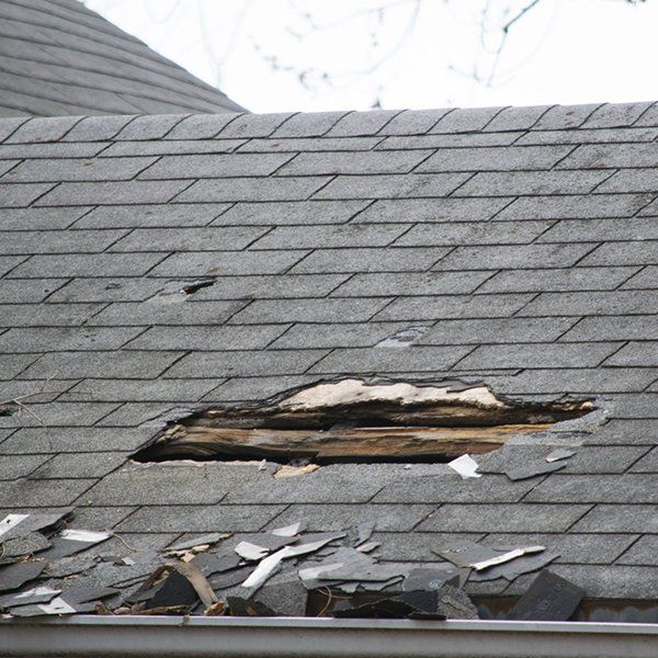 Damaged and Old Roofing Shingles on a House — Watsonville, CA — Watsonville Roofing Inc