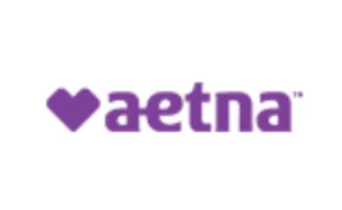 Aetna logo: purple heart symbol next to the word 