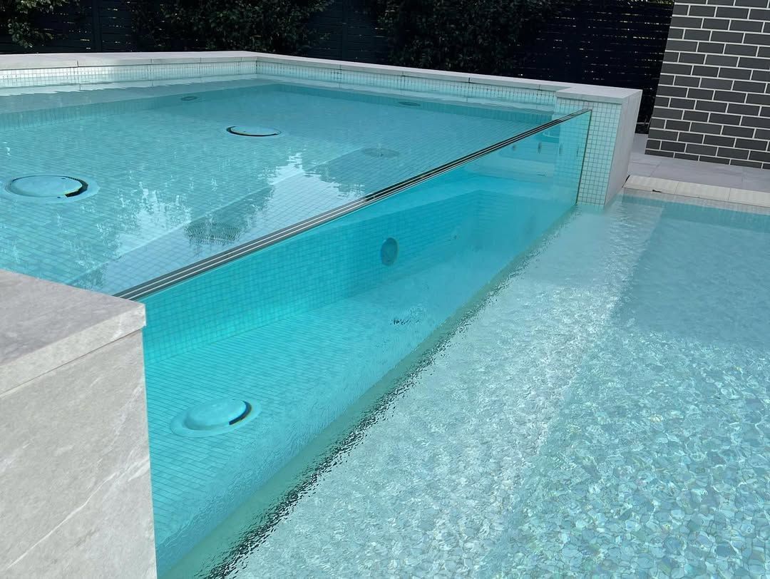 Modern Pool With Glass Wall, Mosaic Tile, and Clear Water — All Glass Balustrading Systems in Wetherill Park, NSW