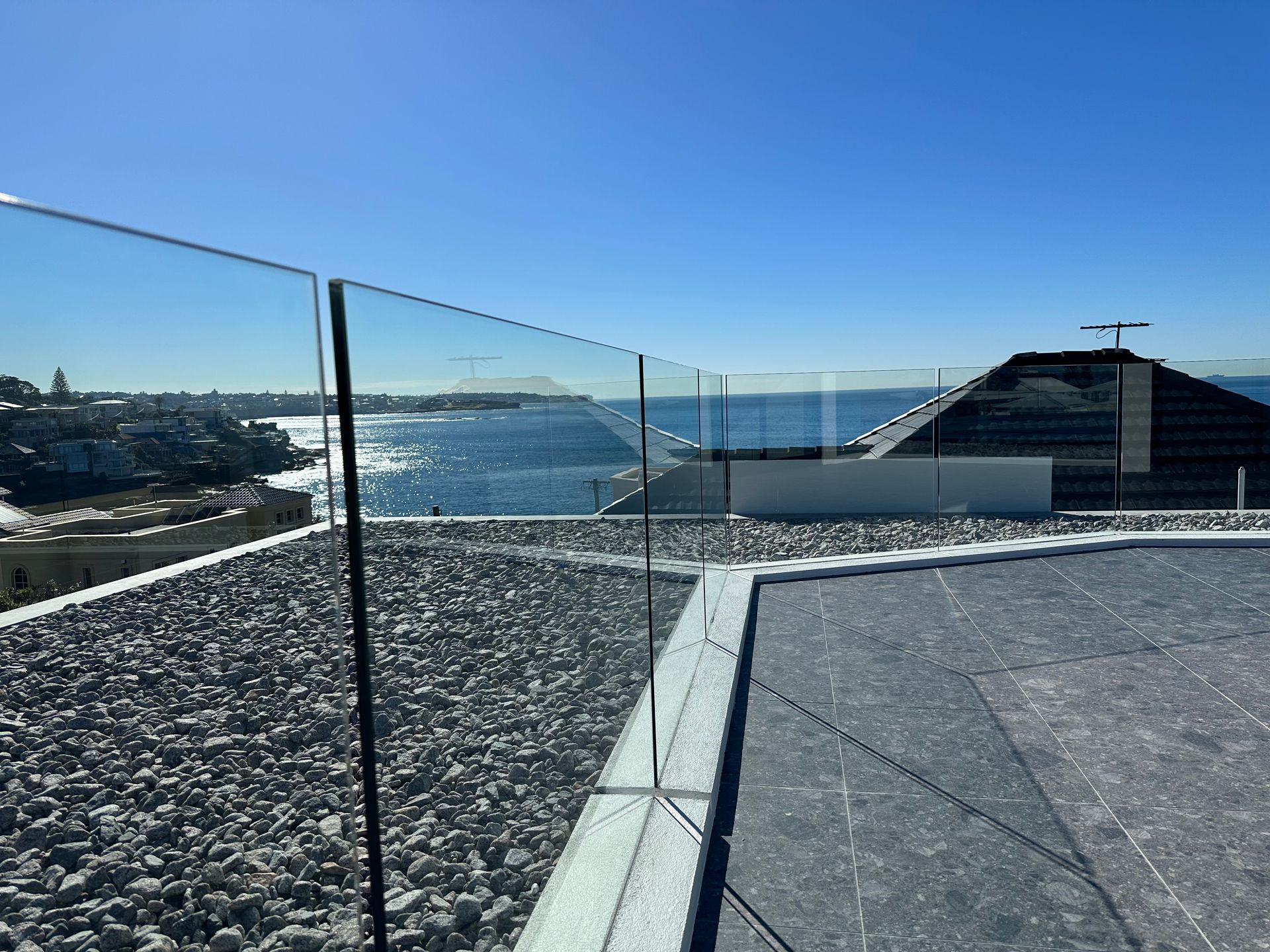 A Modern House With a Balcony Overlooking the Ocean — All Glass Balustrading Systems in Manly, NSW