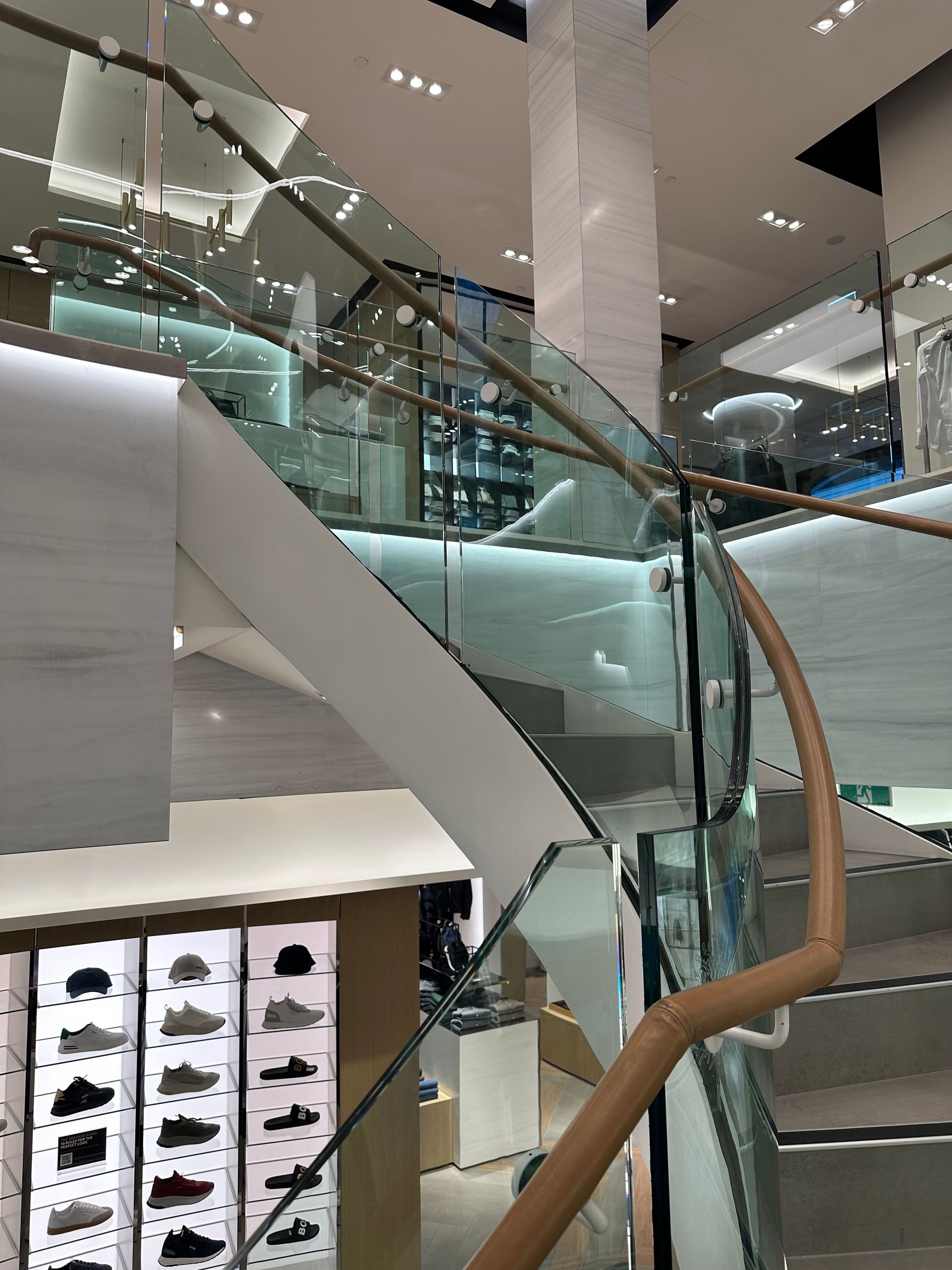 A Staircase With Wooden Steps and a Glass Railing — All Glass Balustrading Systems in Wetherill Park, NSW