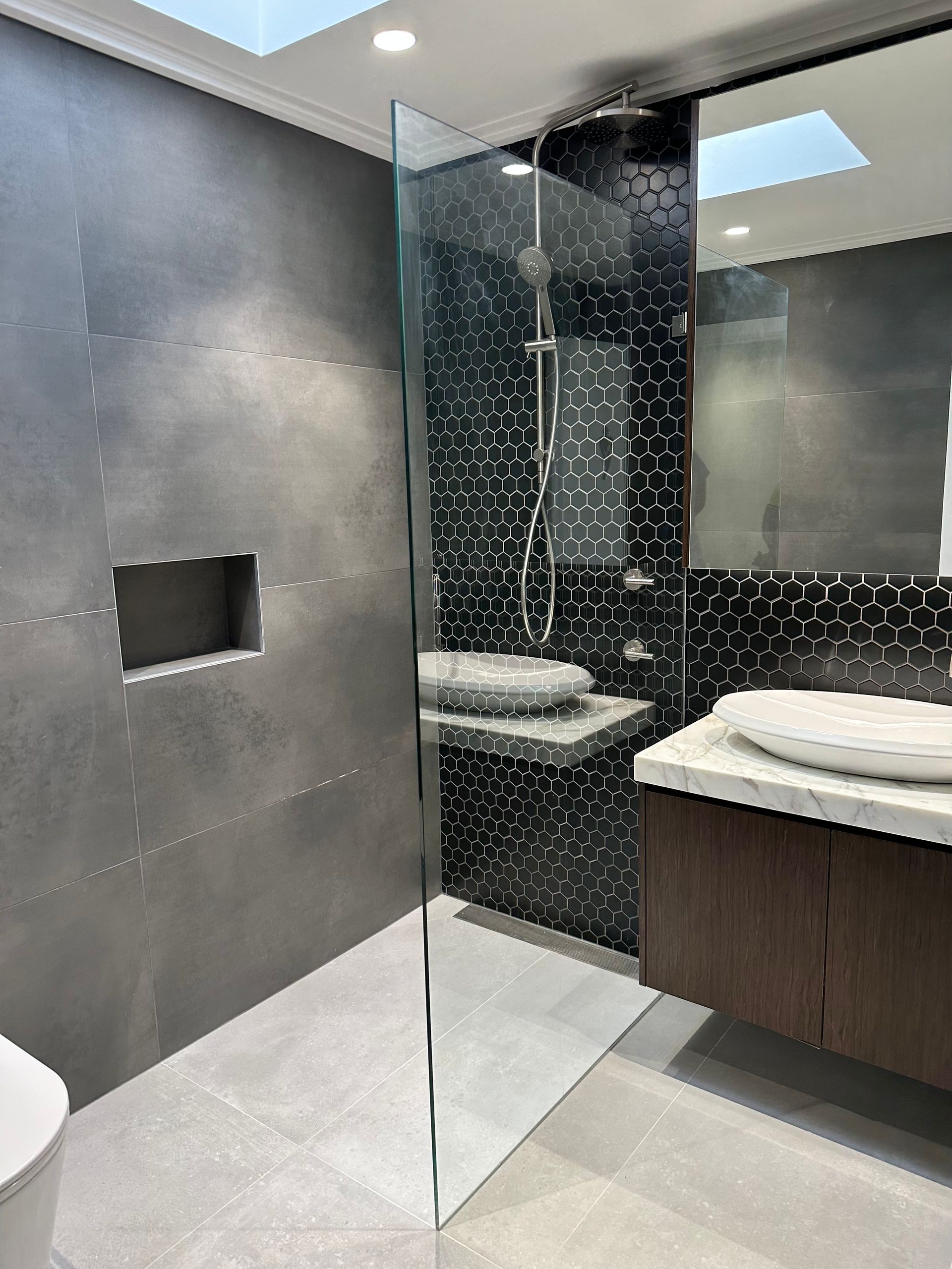 A Bathroom With a Walk in Shower and a Toilet — All Glass Balustrading Systems in Wetherill Park, NSW
