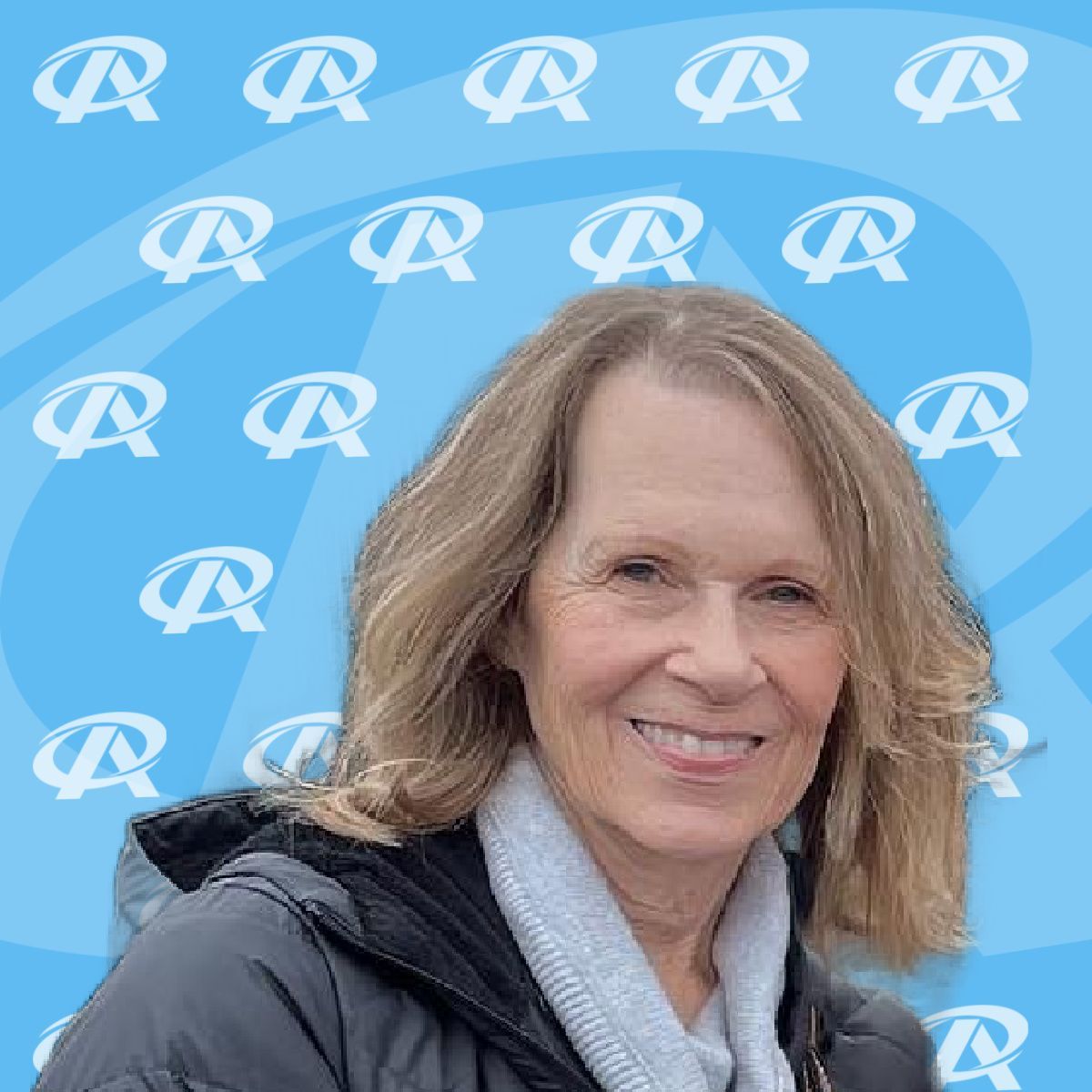 A woman is smiling in front of a blue background with the letter r on it