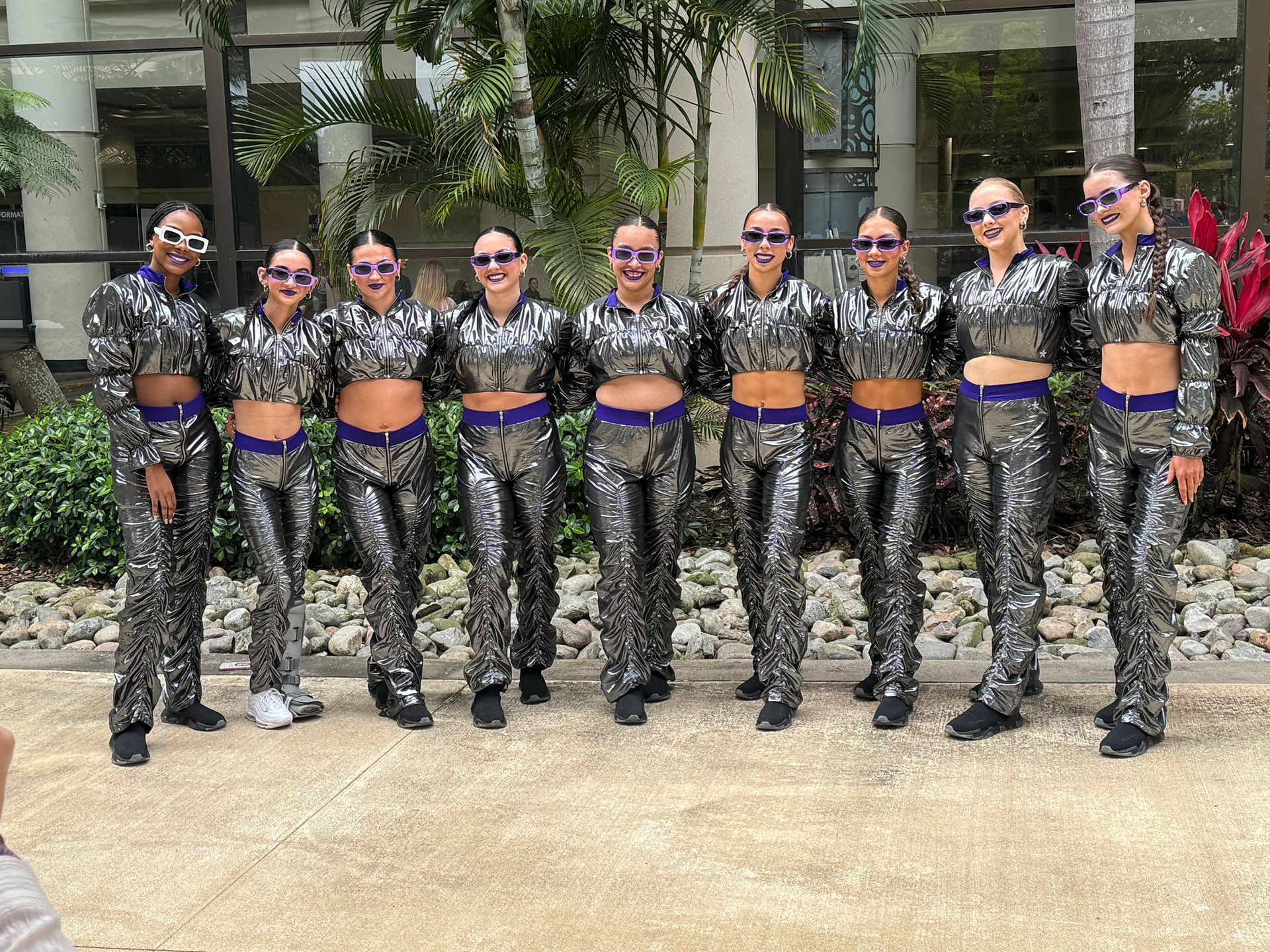 A group of women are posing for a picture together.