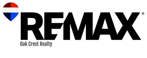 RE/MAX logo with Oak Crest Realty text.