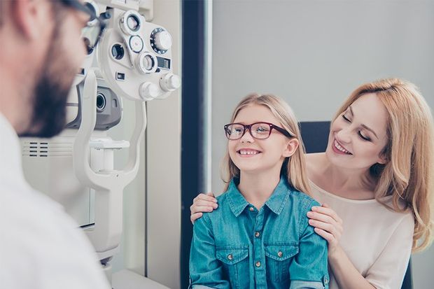 Small Cute Blond Girl is Trying on Glasses — Angleton, TX — Brent Mixon, OD