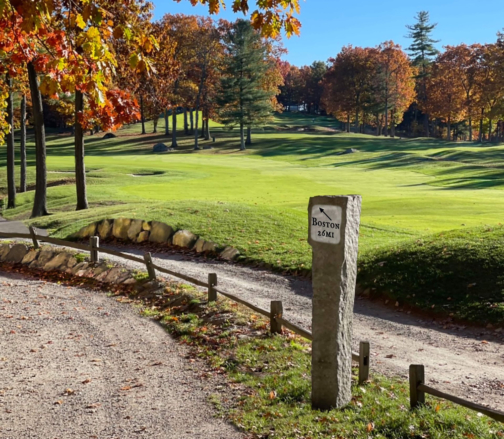 A gravel road leading to a golf course with a stone post that says ' boren ' on it