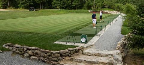 A group of people are playing golf on a golf course.