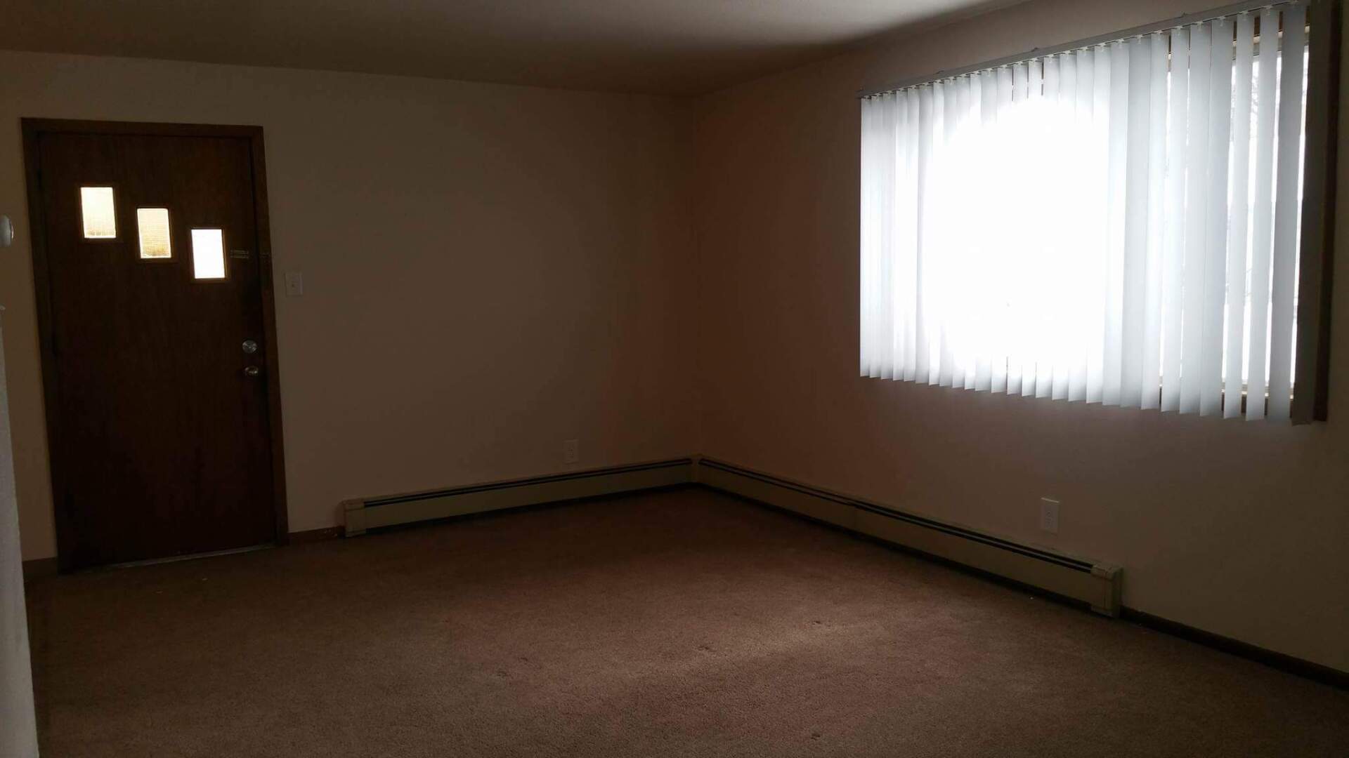 Interior of living room with large window on right side