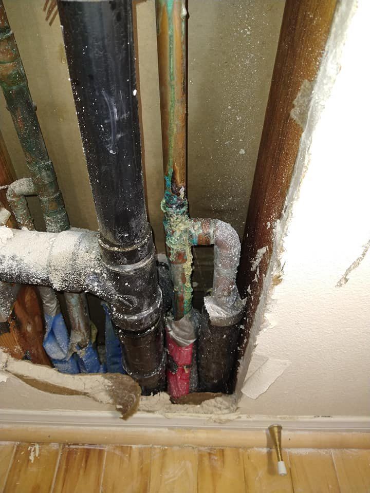 A Bunch of Pipes Are Hanging From the Ceiling in a Room