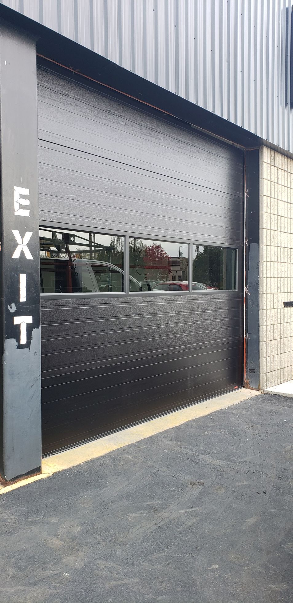 Black textured garage door with an 