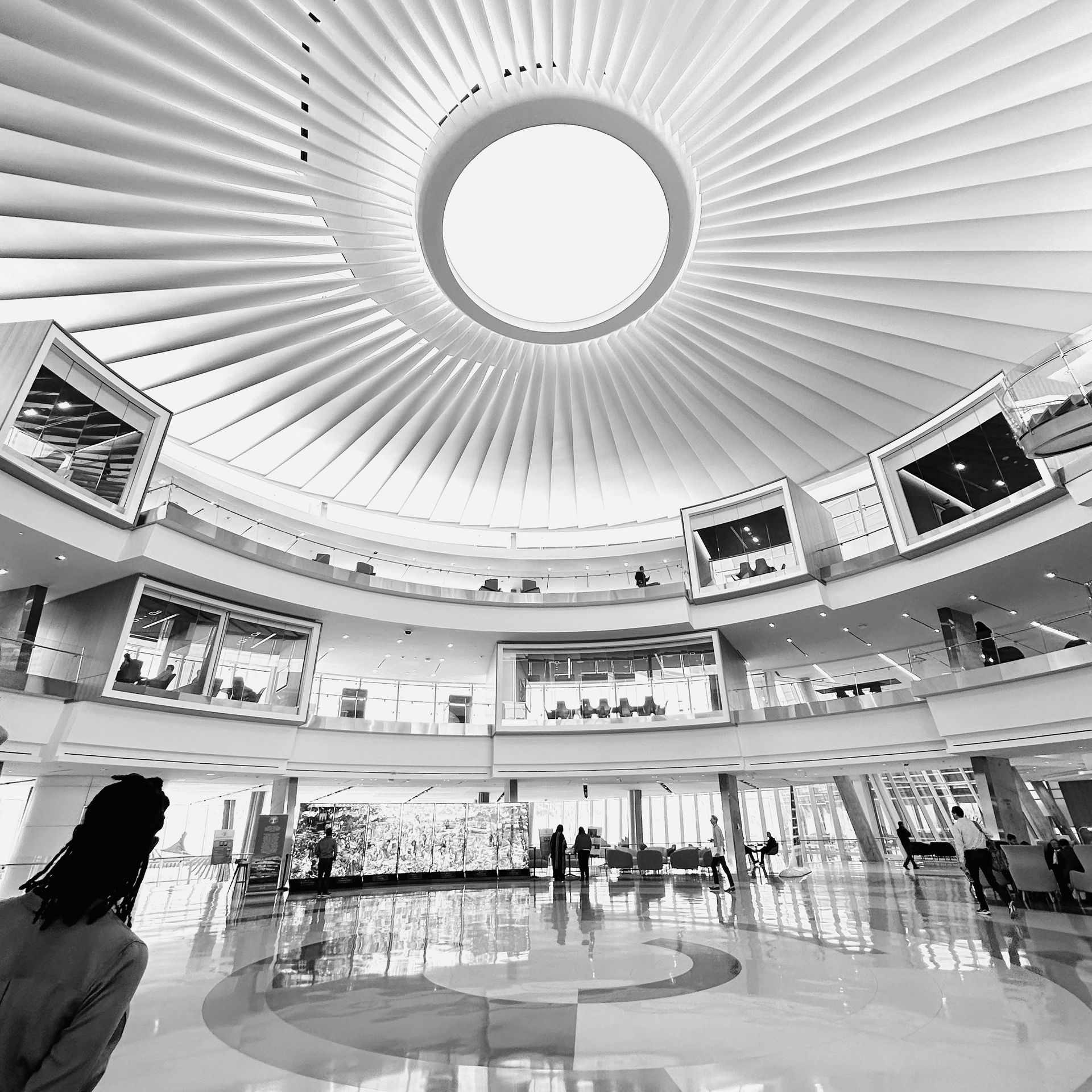 A black and white photo of an interior with a dome ceiling