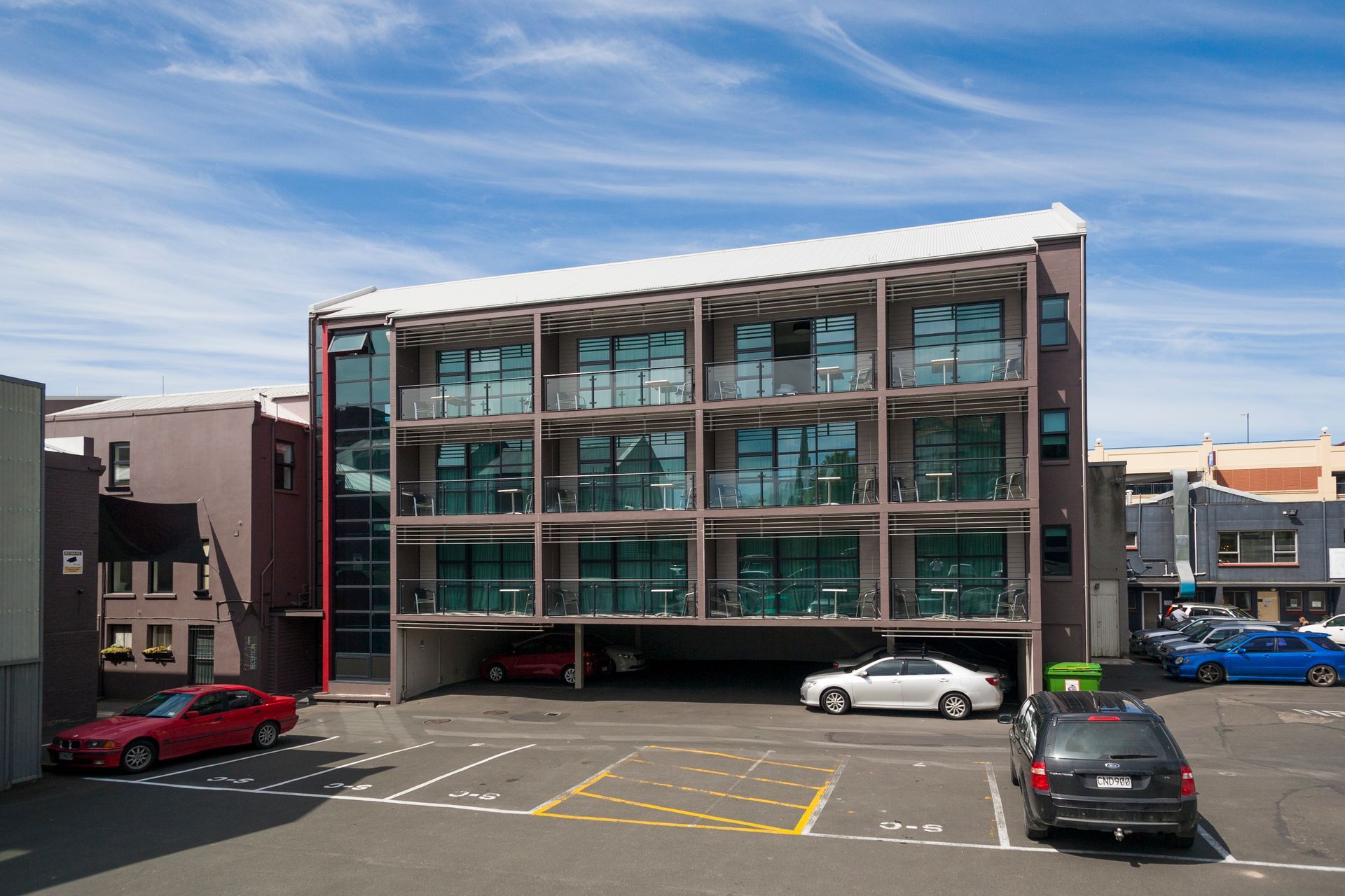 A large building with cars parked in front of it