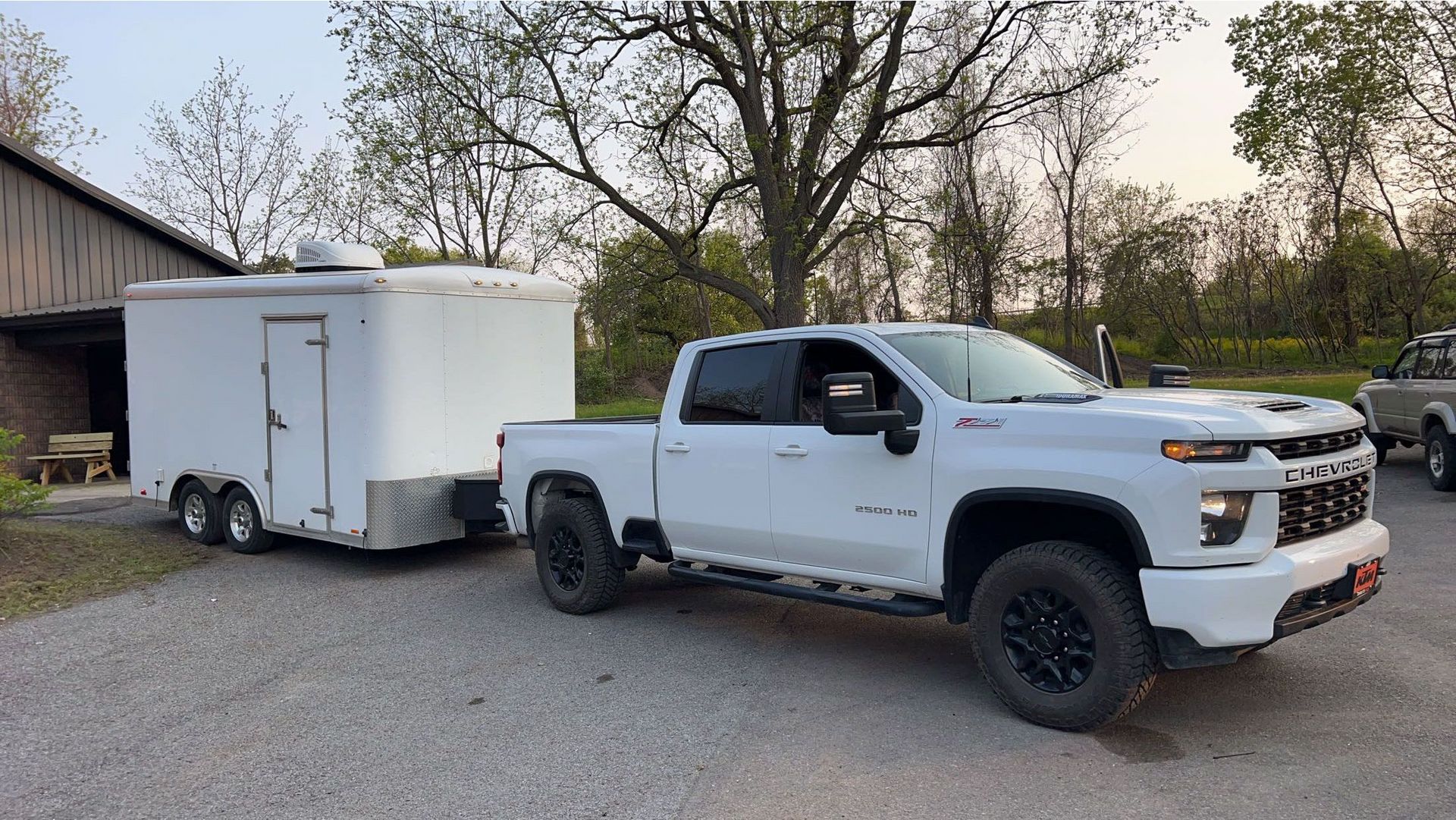 a man in a blue coverall spray painting a wall