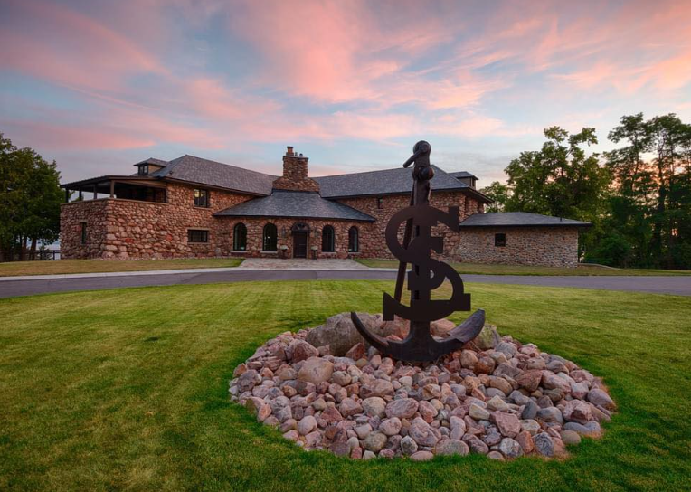 A large house with a large anchor in front of it