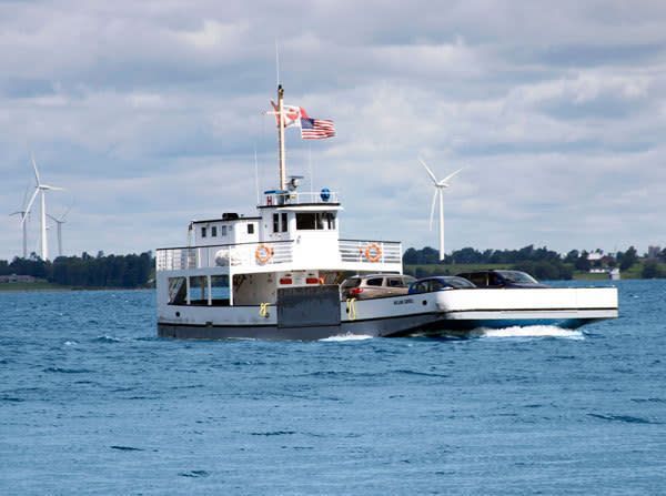 A hotel lobby with a wooden counter and stairs