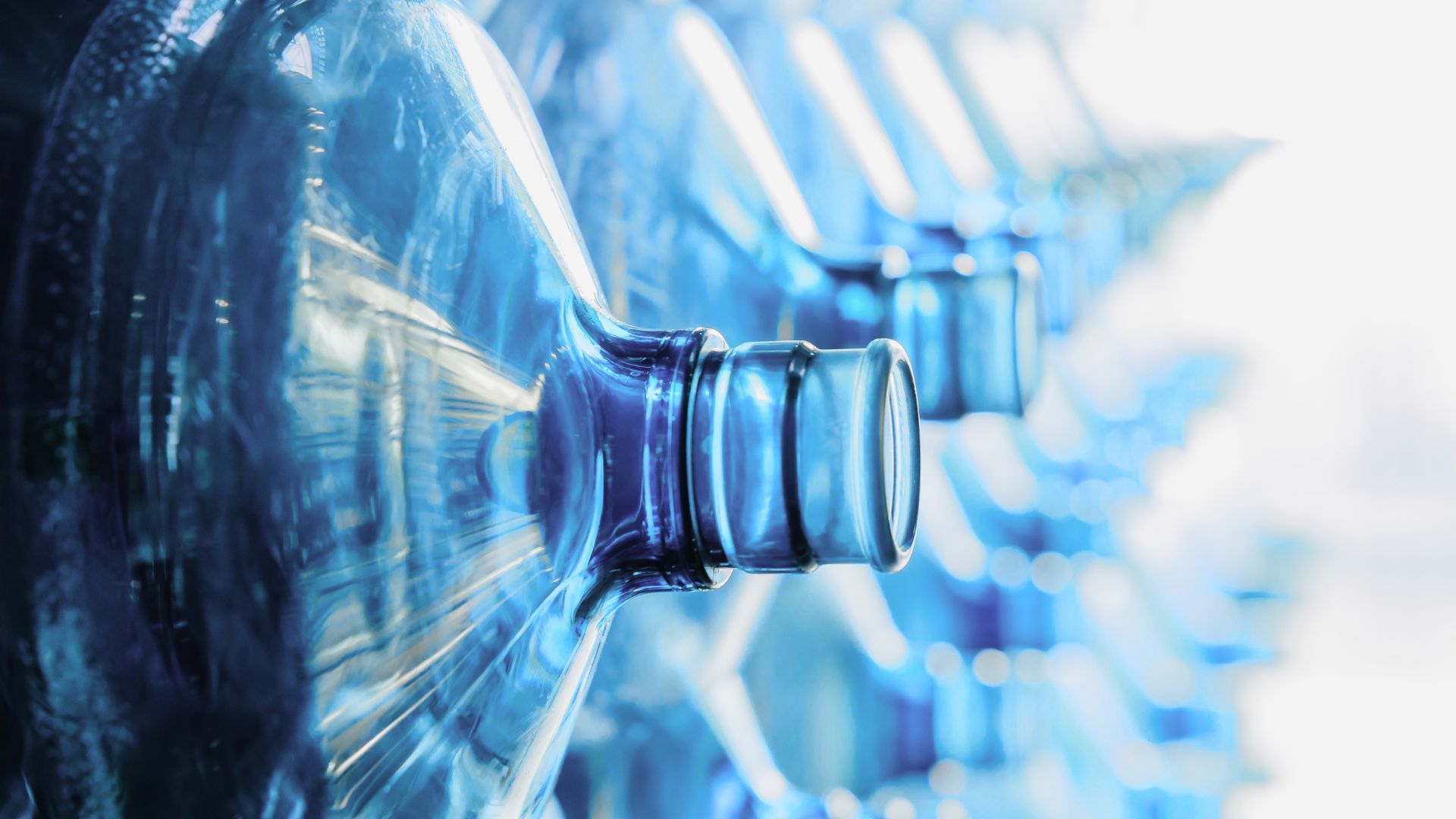 Close-up of clear water bottles for spring water delivery - Indian Peaks Spring Water