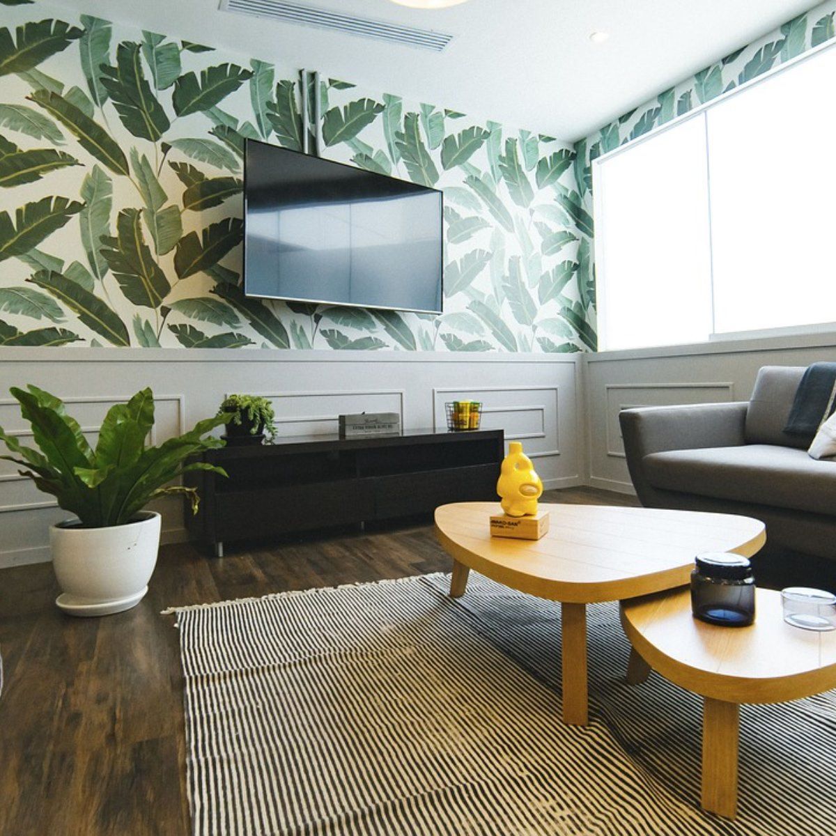 A living room with a couch and two coffee tables