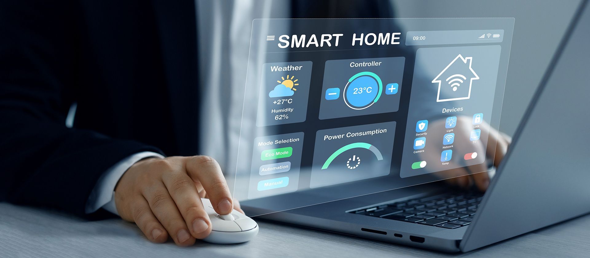 A man is using a laptop computer to control a smart home