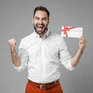 a man in a white shirt is holding a gift voucher