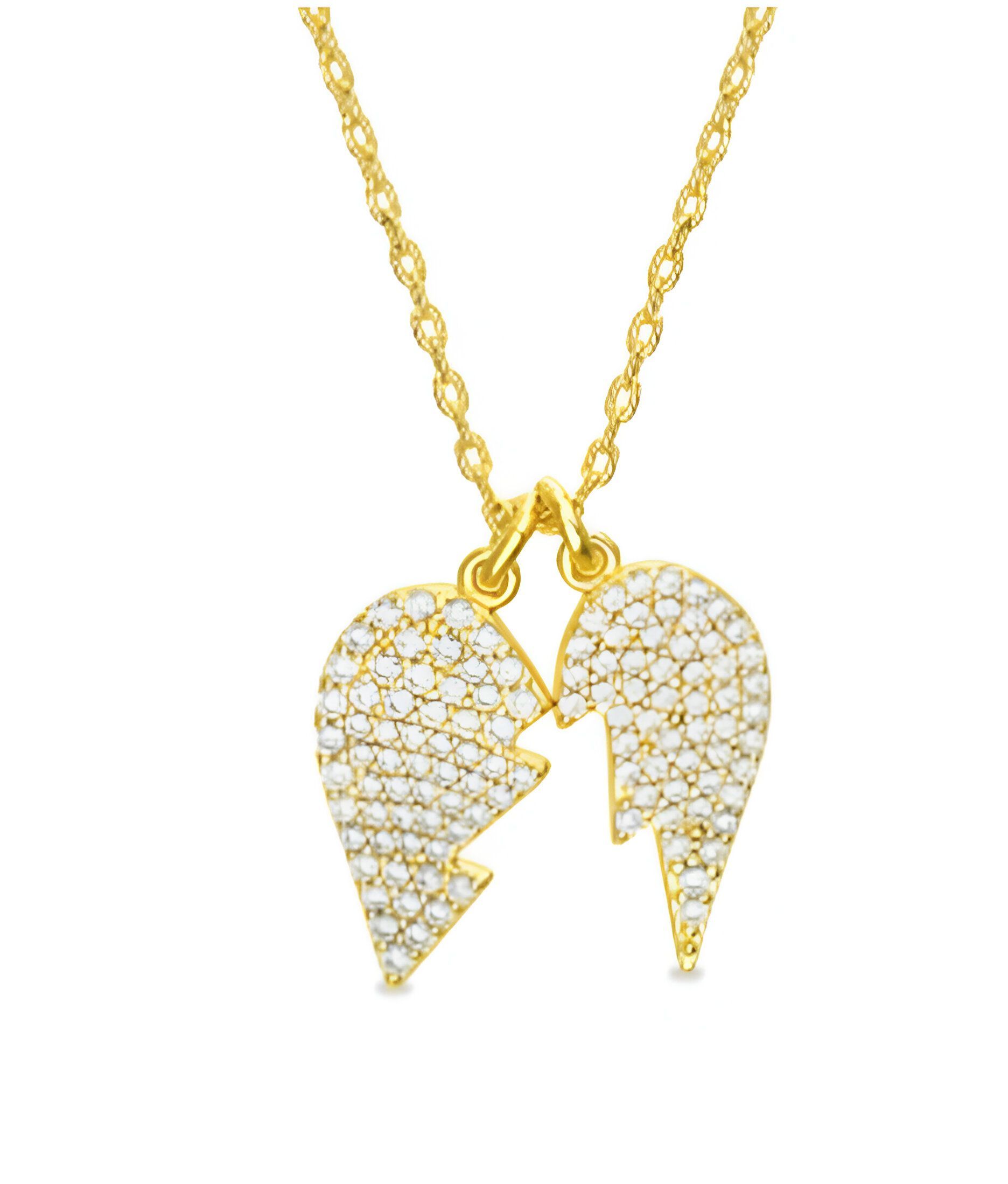 Un collar de oro con un colgante en forma de corazón roto en una cadena.