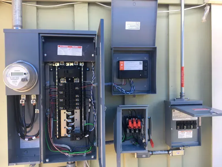 A close up of a electrical box on a wall.