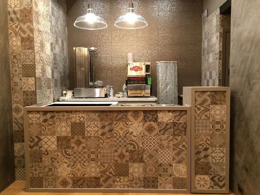 A kitchen with a counter and a machine on top of it