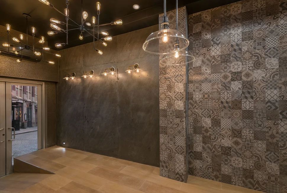 There are a lot of lights hanging from the ceiling in this room.