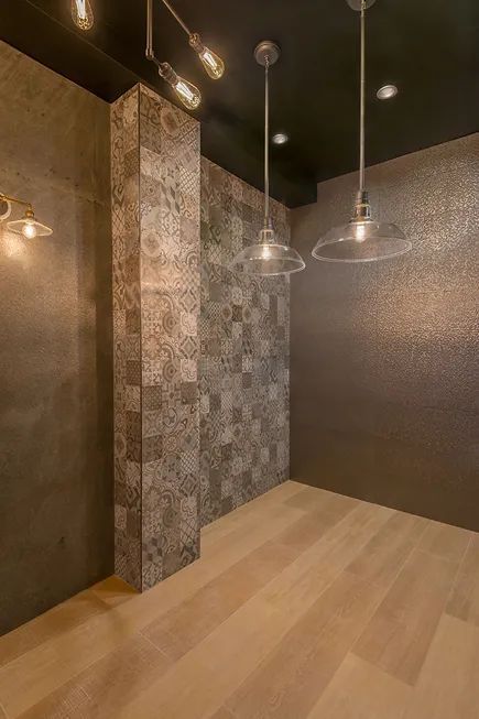 There are a lot of lights hanging from the ceiling in this room.