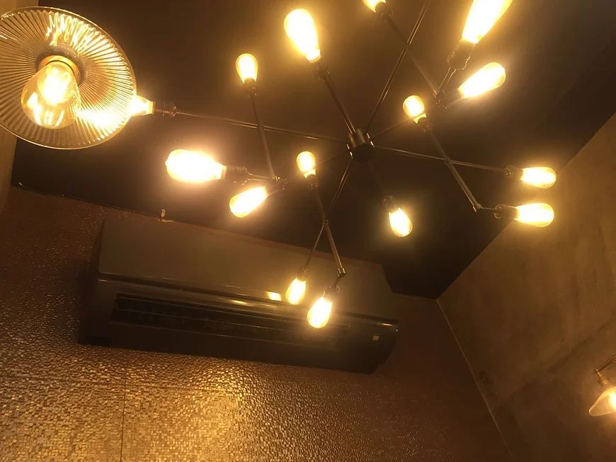 A ceiling with a lot of lights hanging from it