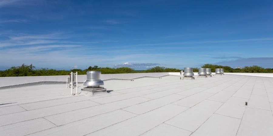 A white roof with a blue sky in the background.