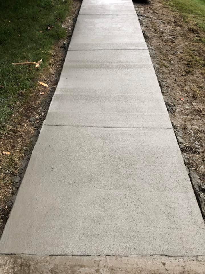 A freshly poured concrete sidewalk