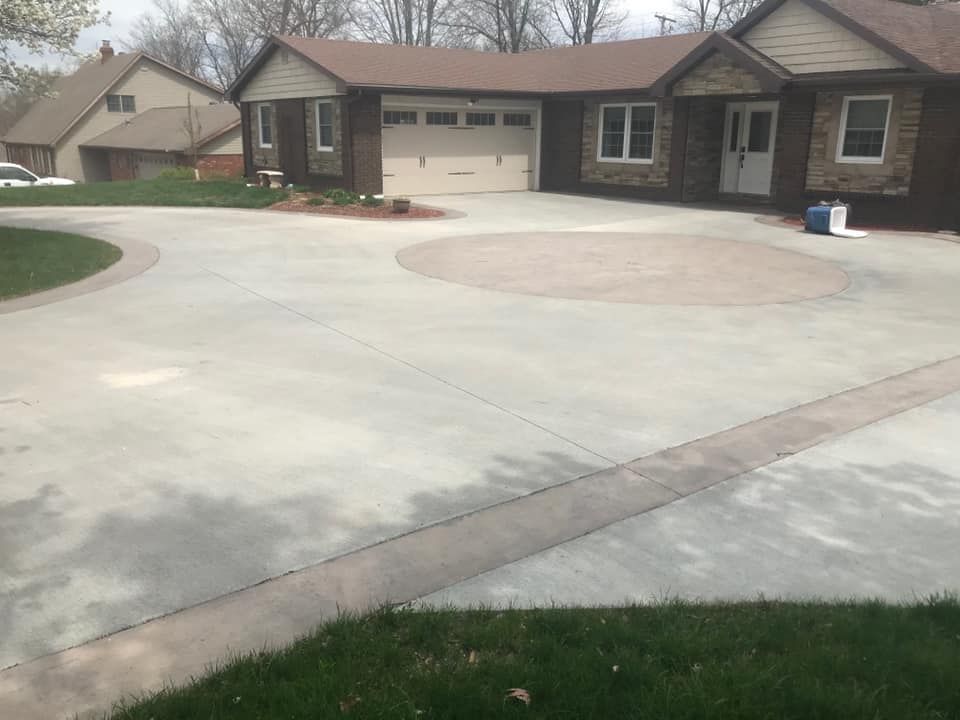 beautiful concrete driveway with decorative stamping and staining