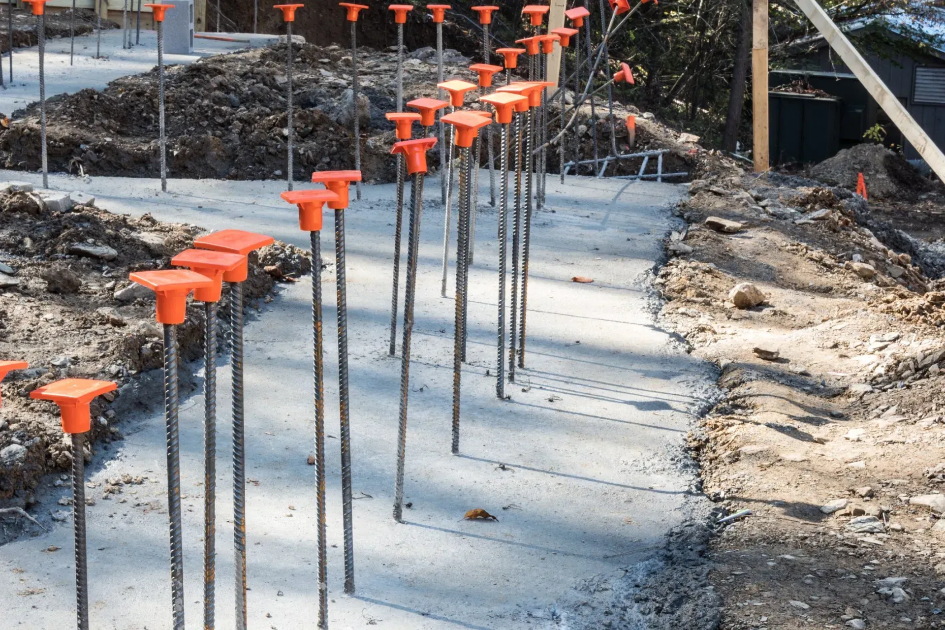 Concrete footings with rebar jutting out