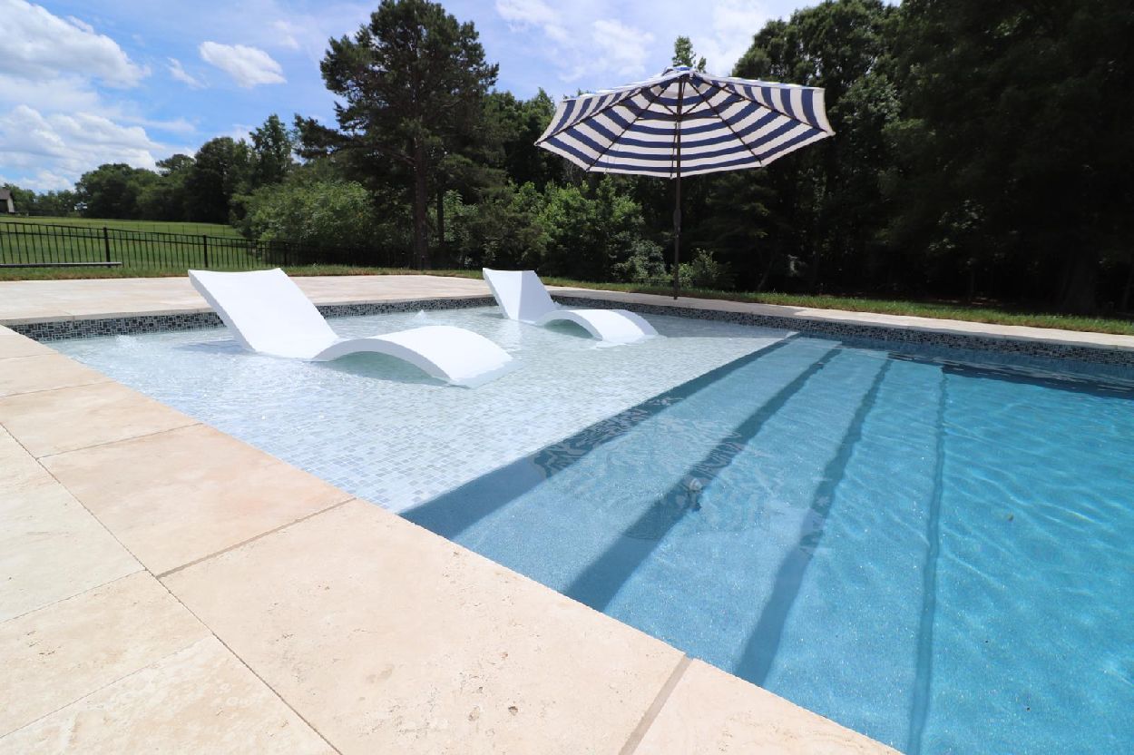 The oceanside beach pool with a focus on the beach entry