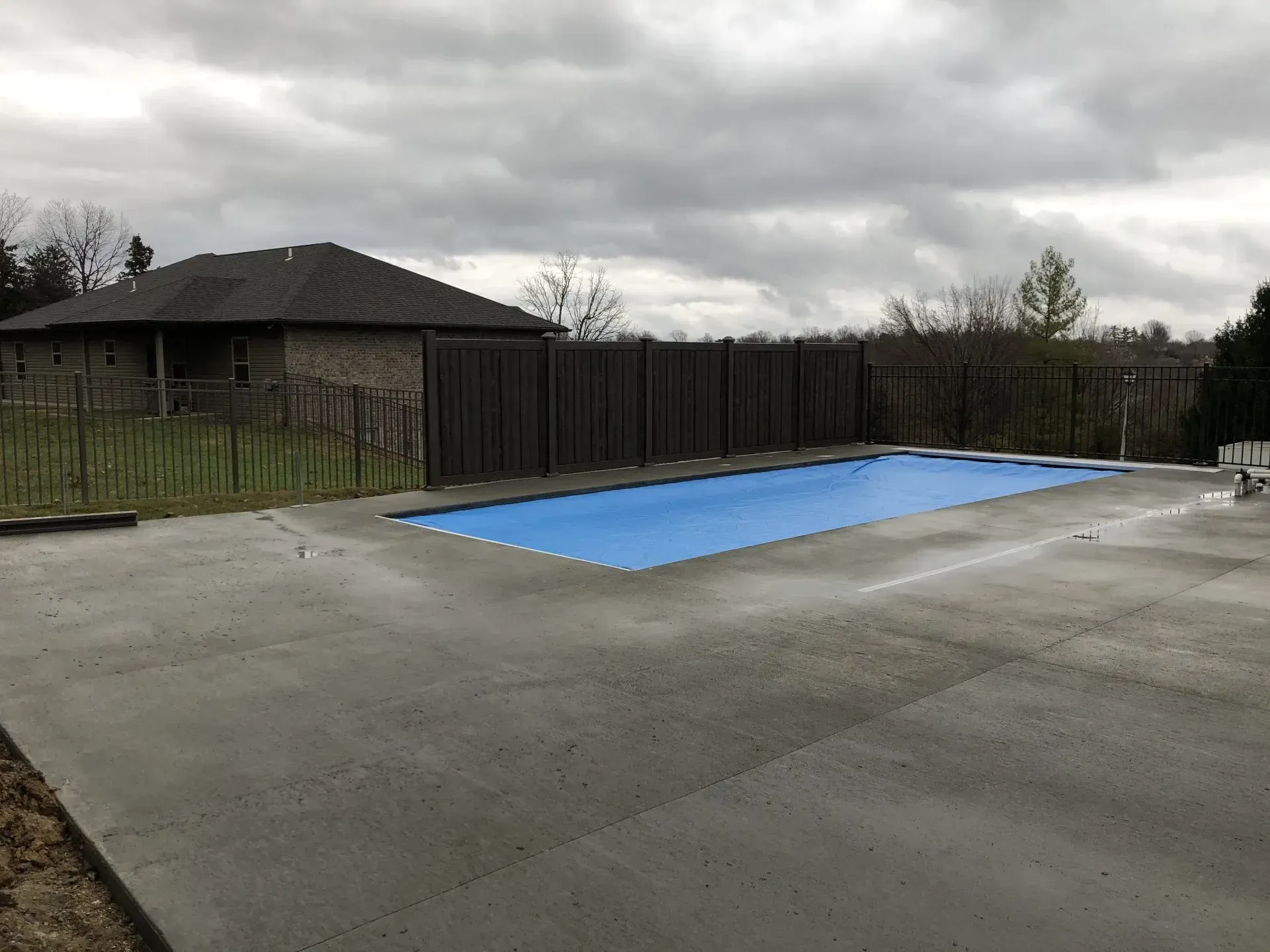 rectangle pool covered on a cloudy day