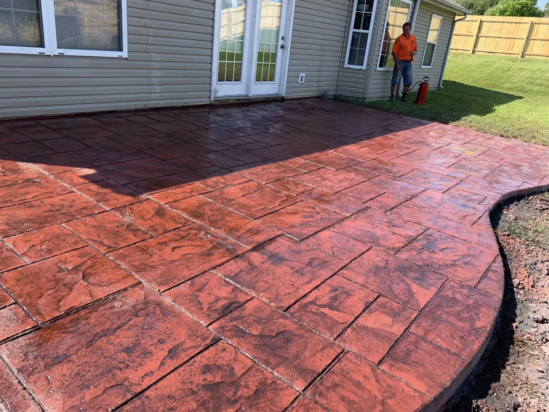 Stamped and red-stained concrete patio