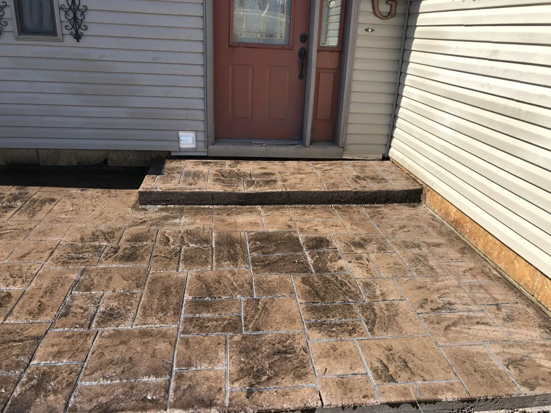 stamped and stained concrete front patio