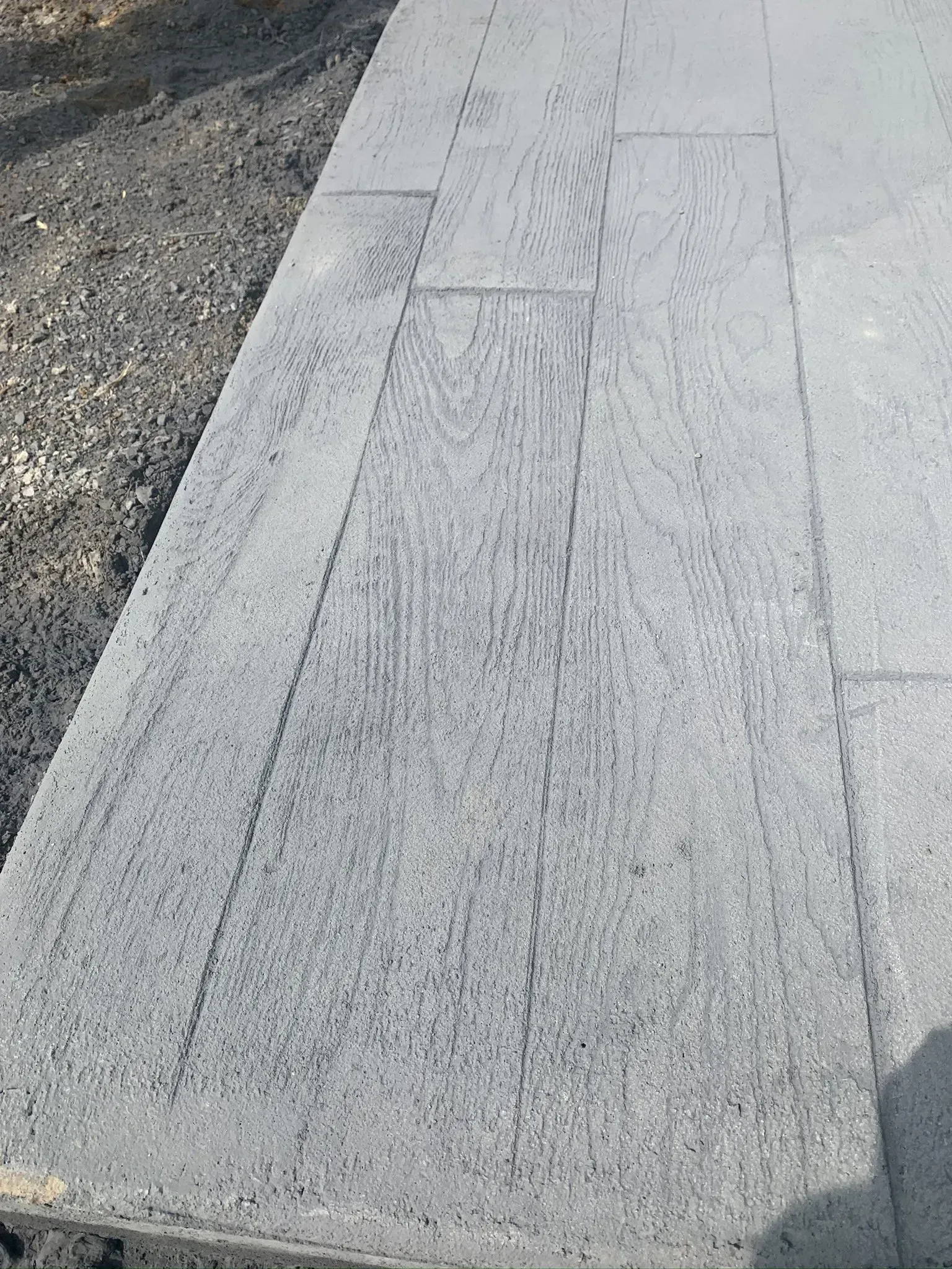 stamped concrete pad to look like wood